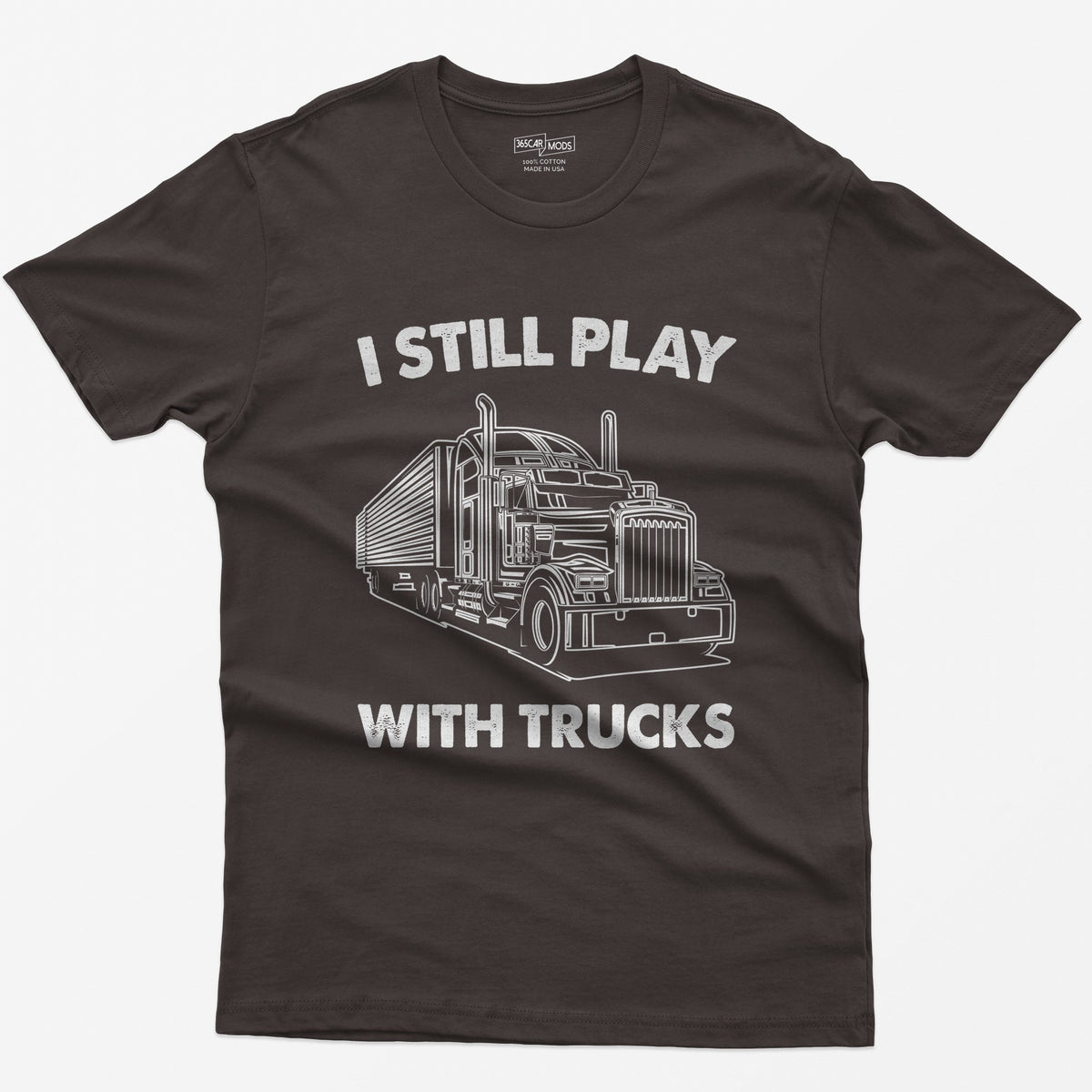 Dark Chocolate t-shirt with I Still Play With Trucks text and a white line drawing of a long-nose semi truck with trailer