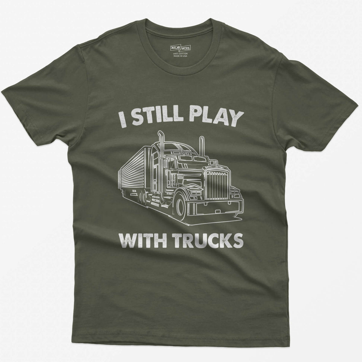 Military Green t-shirt with I Still Play With Trucks text and a white line drawing of a long-nose semi truck with trailer