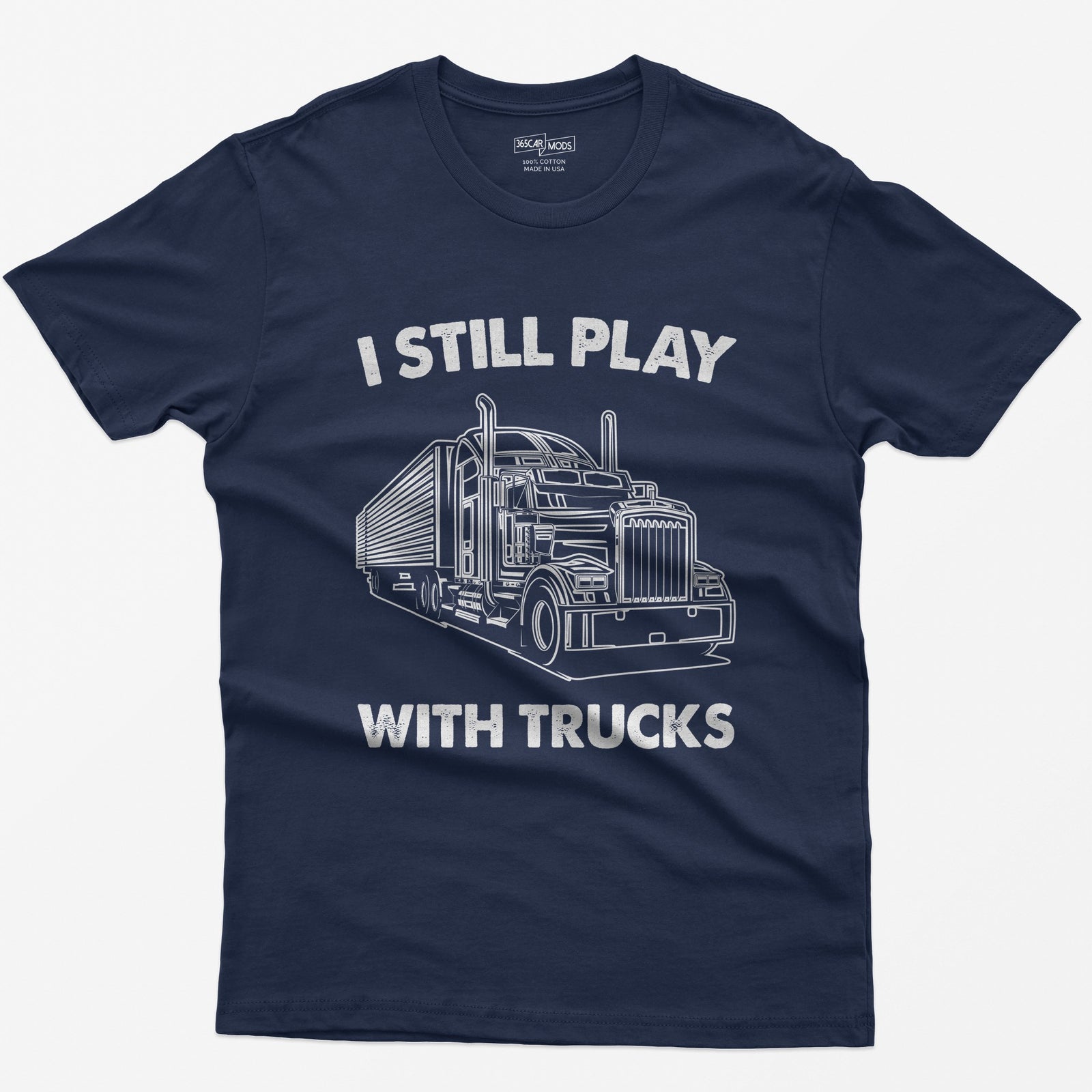 Navy t-shirt with I Still Play With Trucks text and a white line drawing of a long-nose semi truck with trailer