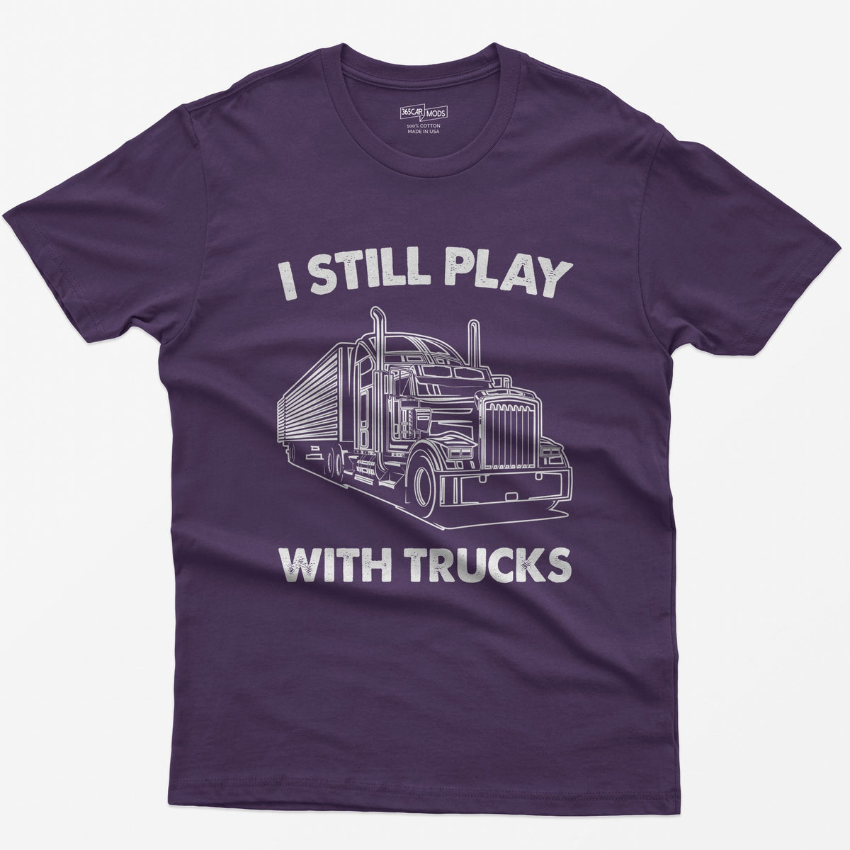 Purple t-shirt with I Still Play With Trucks text and a white line drawing of a long-nose semi truck with trailer