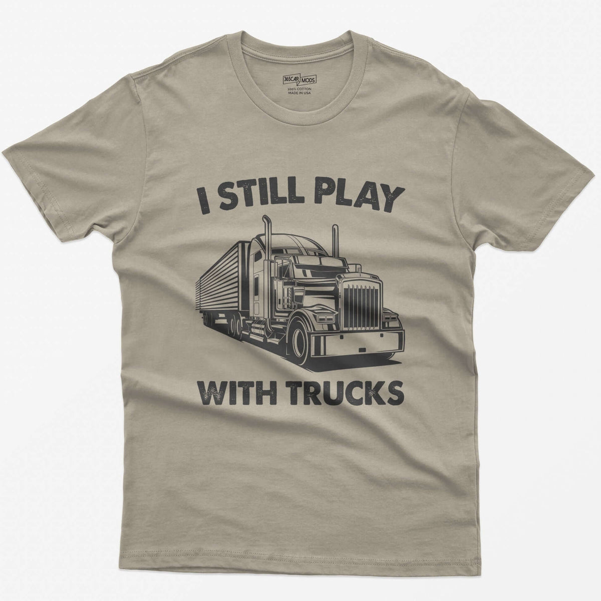 Sand t-shirt with I Still Play With Trucks text and a white line drawing of a long-nose semi truck with trailer