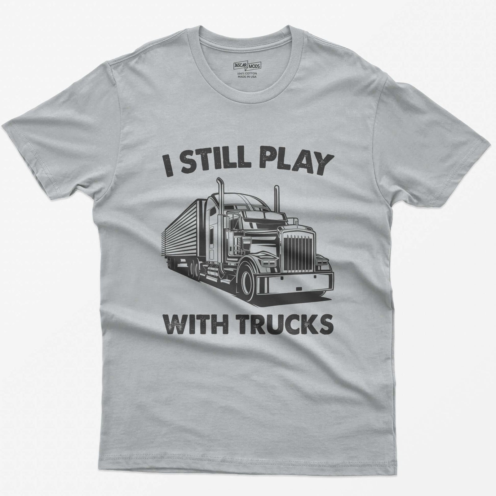 Sport Grey t-shirt with I Still Play With Trucks text and a white line drawing of a long-nose semi truck with trailer