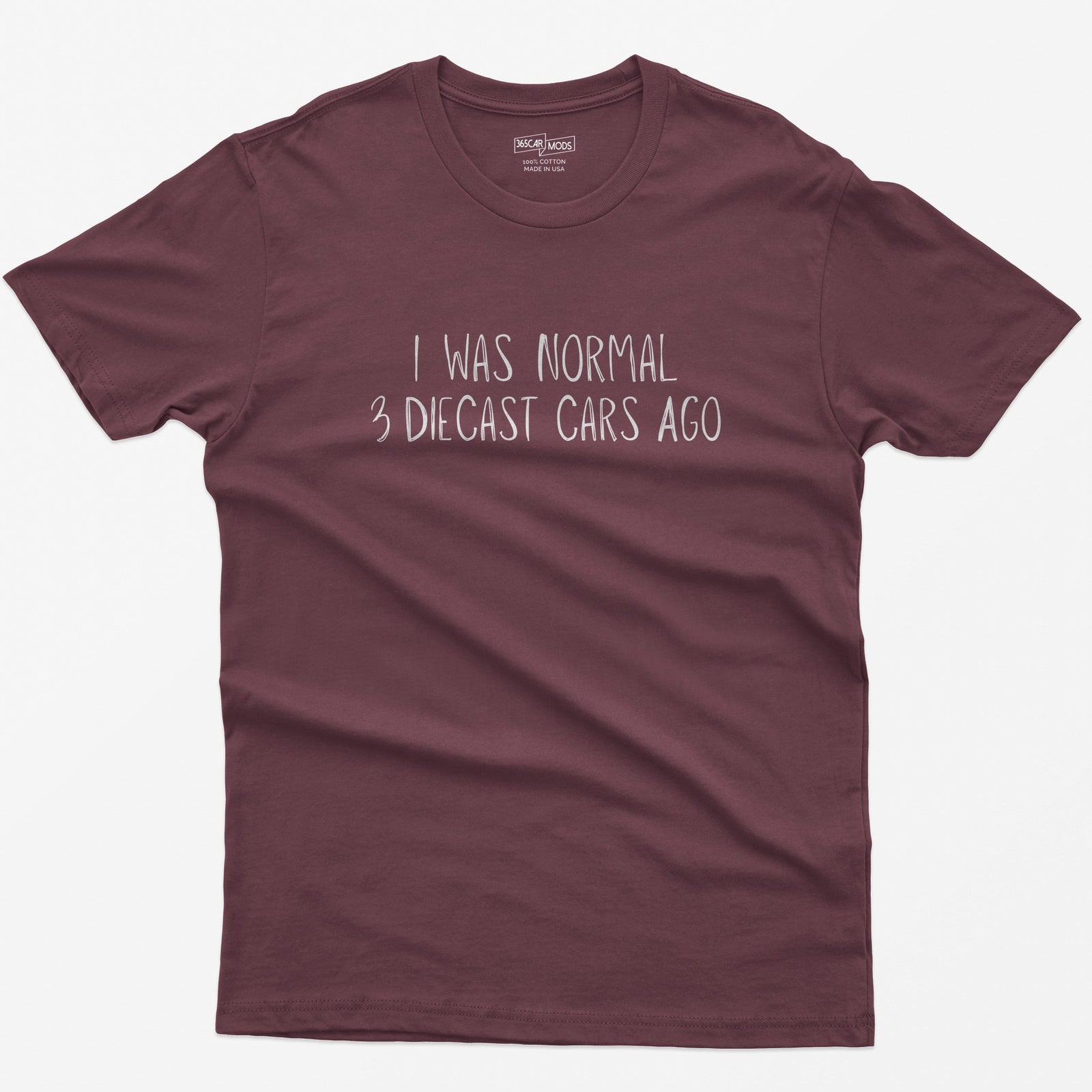 Maroon t-shirt with I Was Normal 3 Diecast Cars Ago in white handwritten lettering