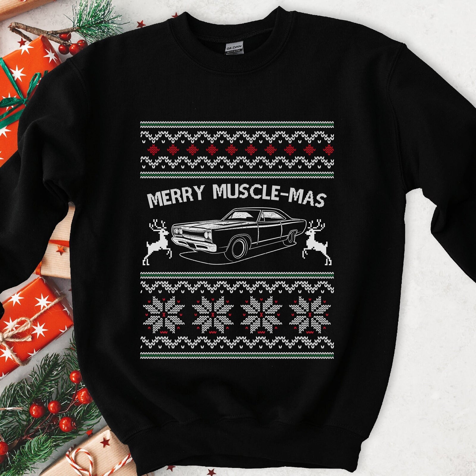 Dark Christmas sweatshirt with a 1960s muscle car and two knit reindeer under MERRY MUSCLE-MAS, snowflake bands