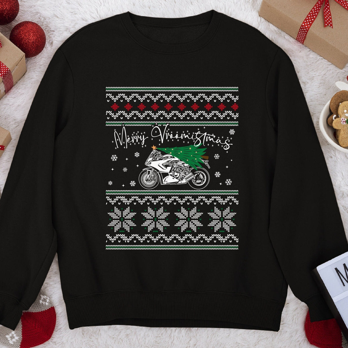 Dark Christmas sweatshirt with a sportbike carrying a tree under script Merry Vroomistmas, snowflake knit bands