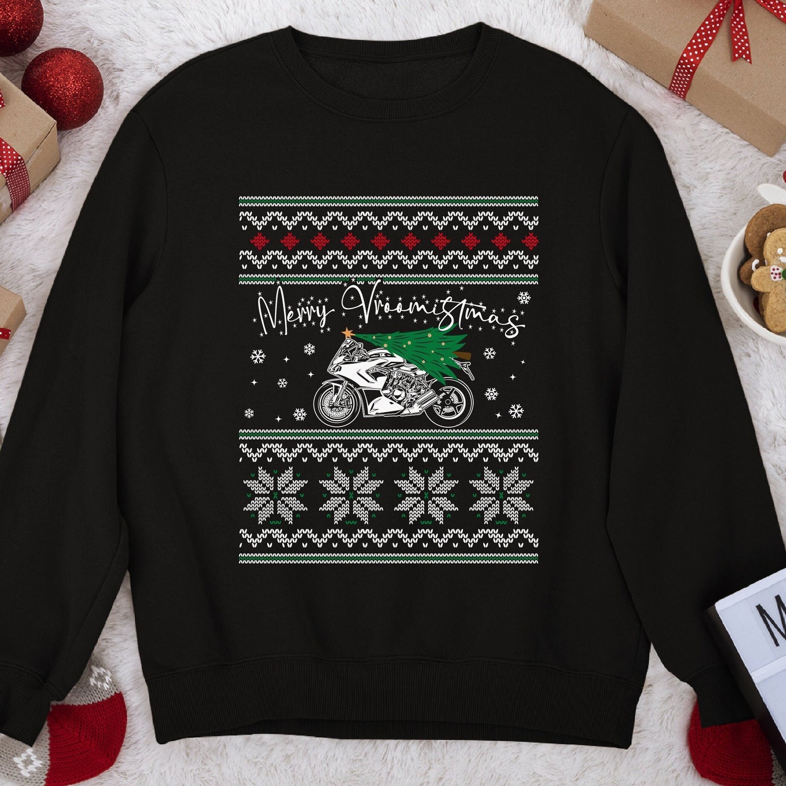 Dark Christmas sweatshirt with a sportbike carrying a tree under script Merry Vroomistmas, snowflake knit bands