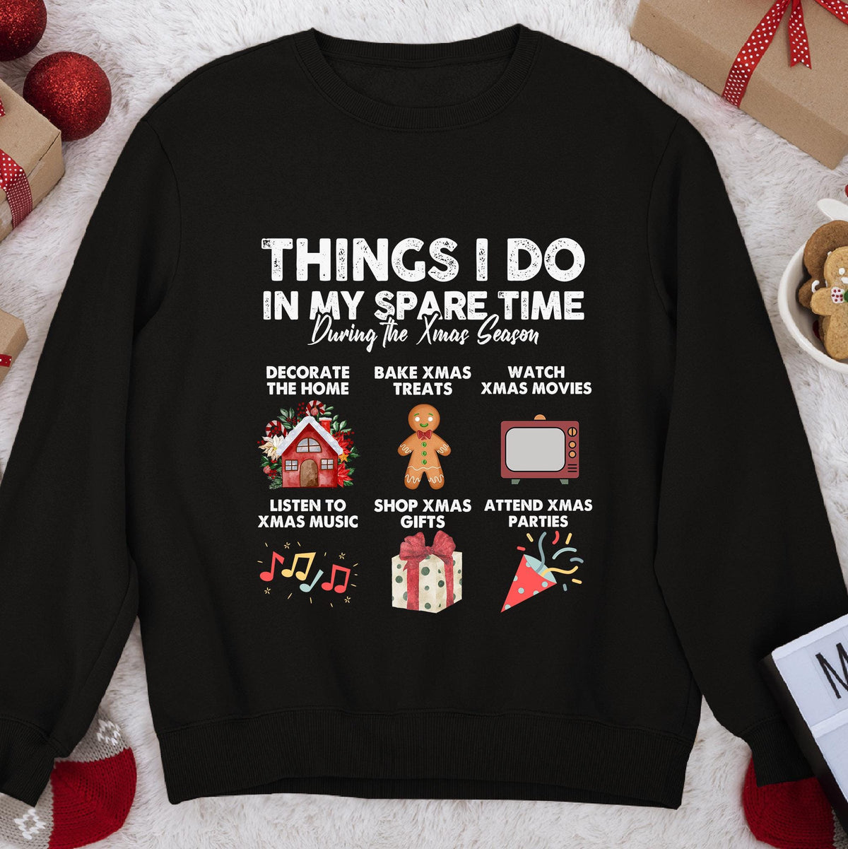 Dark sweatshirt with text Things I Do In My Spare Time During the Xmas Season and six holiday activity icons