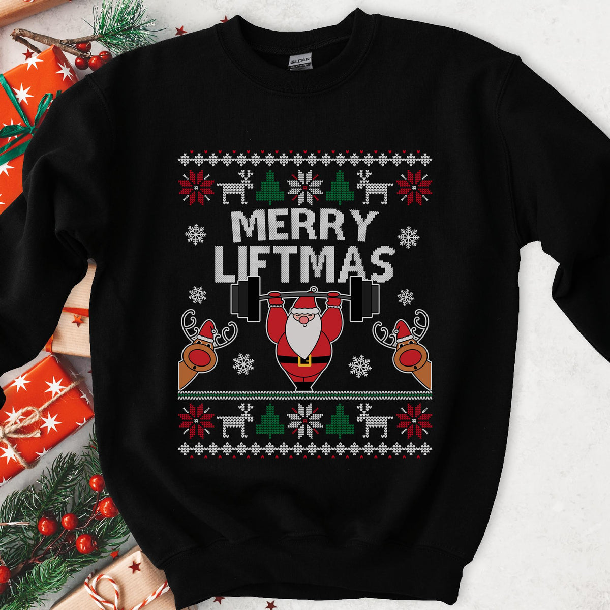 Dark sweatshirt with knit borders, Santa pressing a barbell overhead and two peeking reindeer, text Merry Liftmas