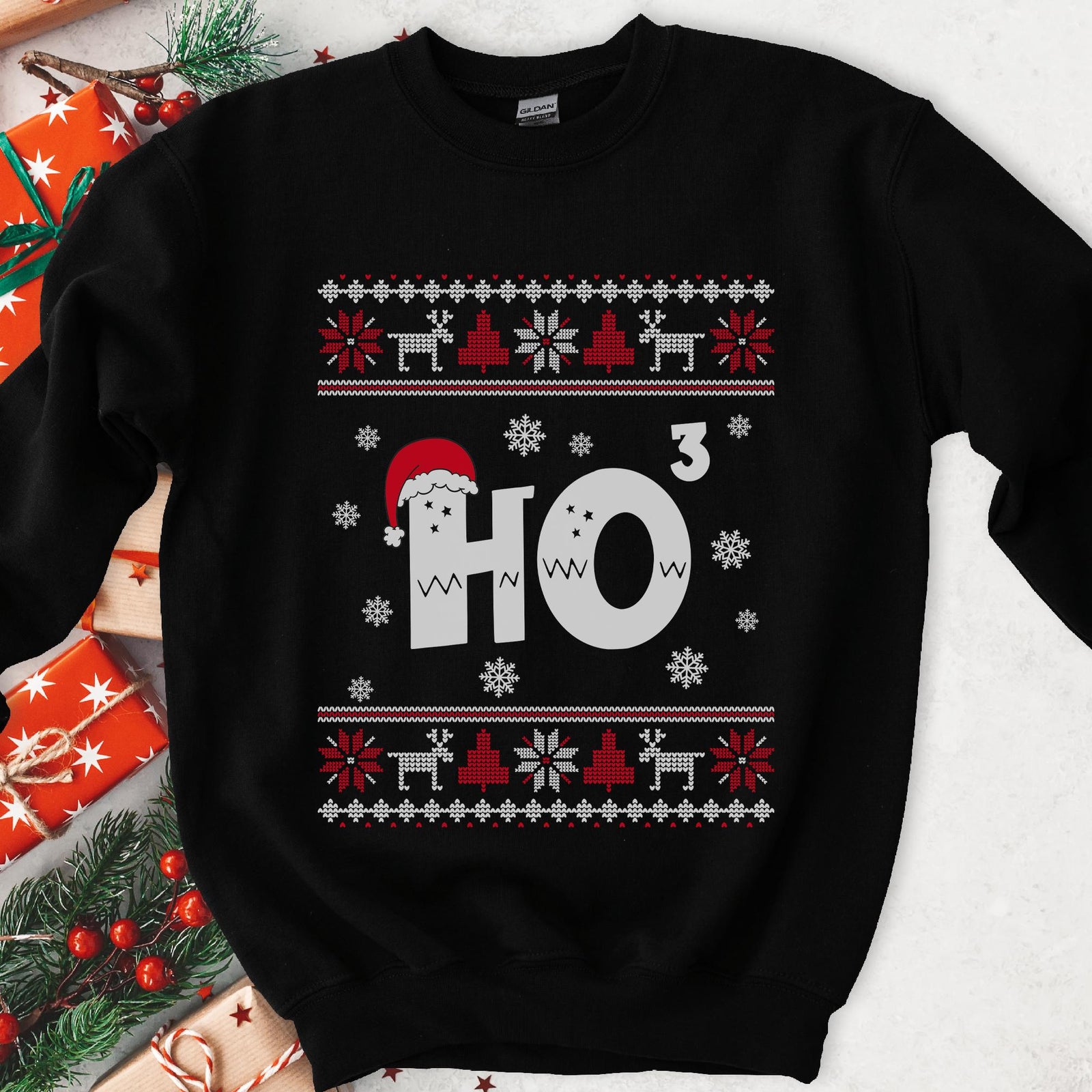 Dark sweatshirt with red and white knit borders, a white HO wearing a Santa hat and a superscript 3, snowflakes