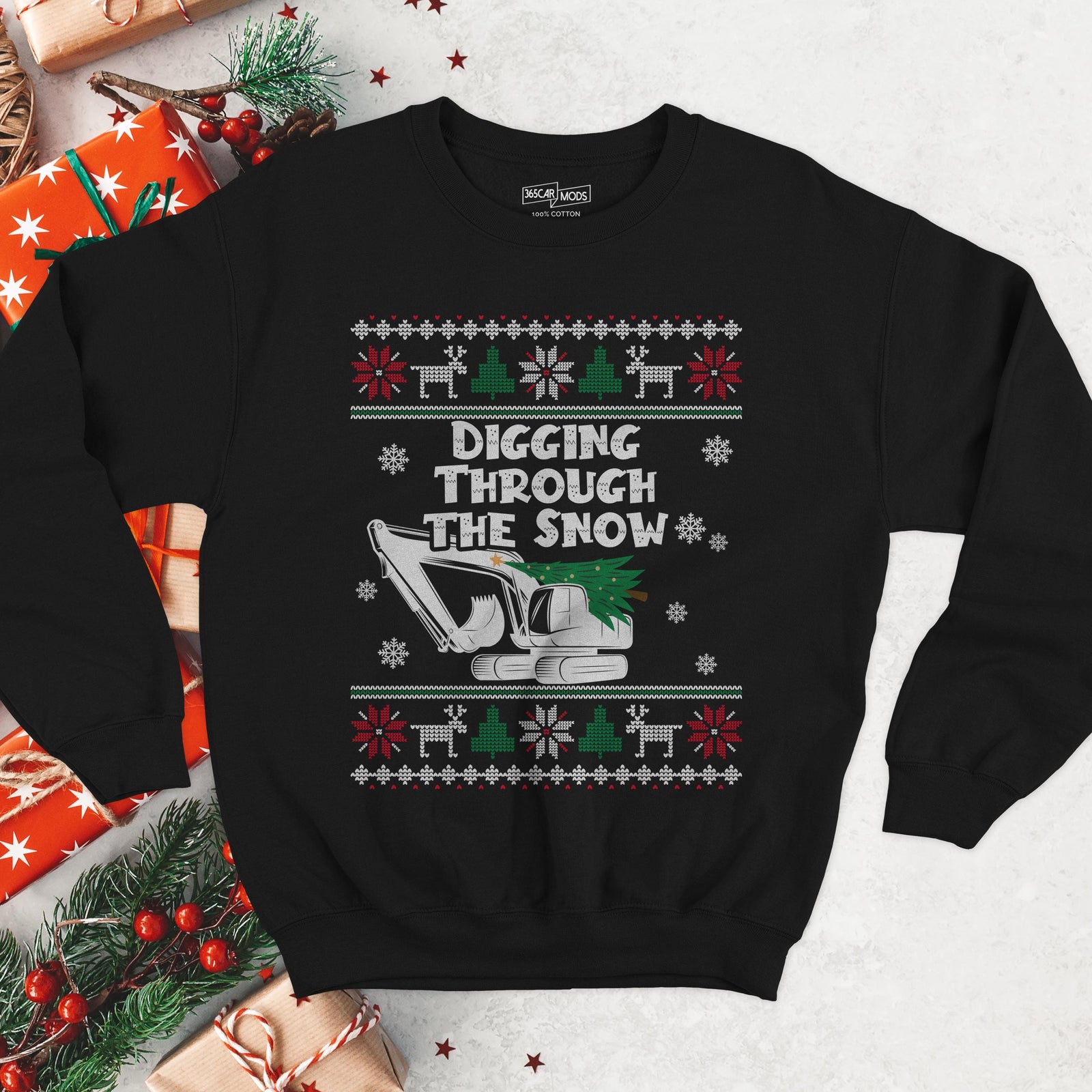 Dark Christmas sweatshirt with an excavator carrying a Christmas tree, DIGGING THROUGH THE SNOW, knit borders