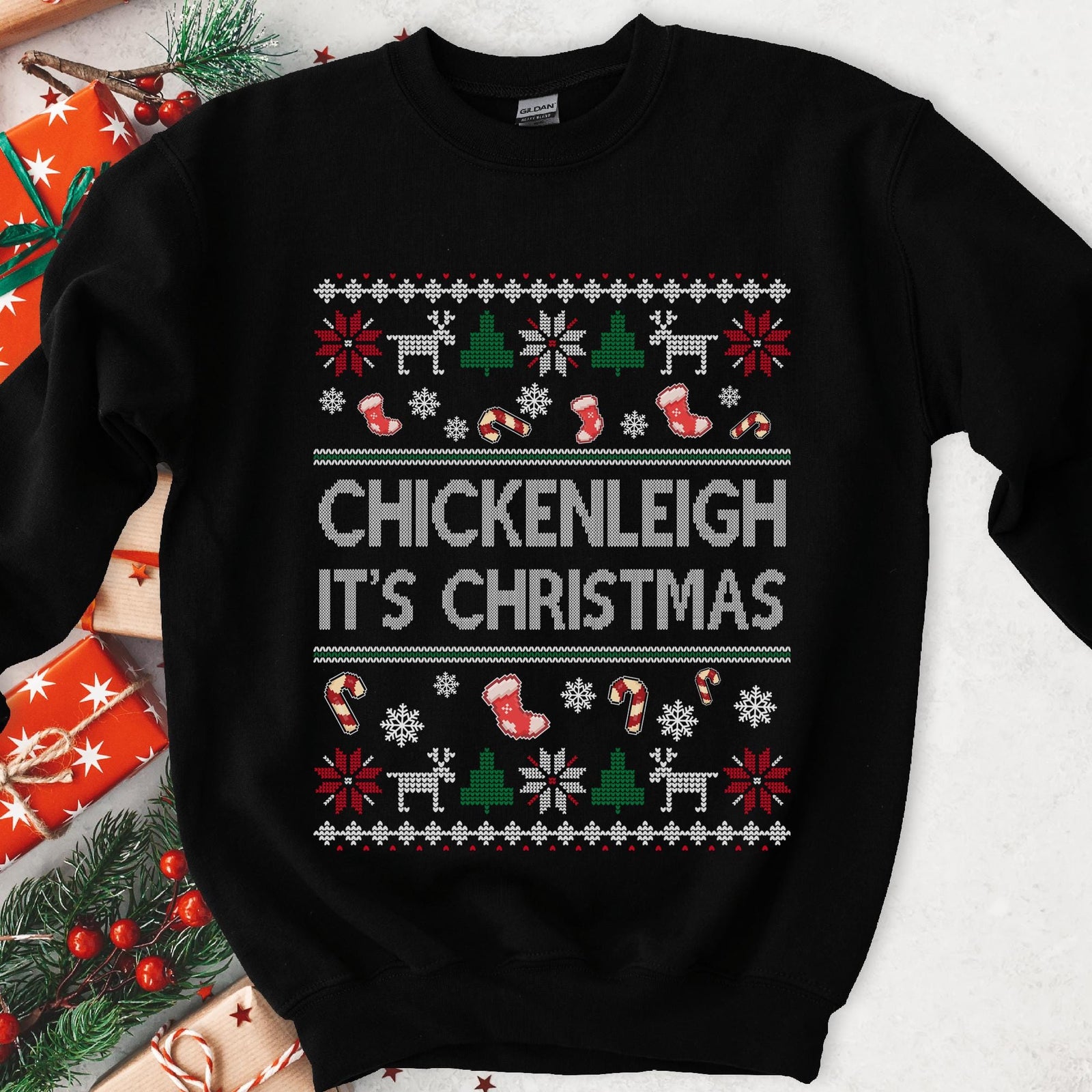 Dark sweatshirt with knit borders, pixel stockings and candy canes, white knit text Chickenleigh It's Christmas