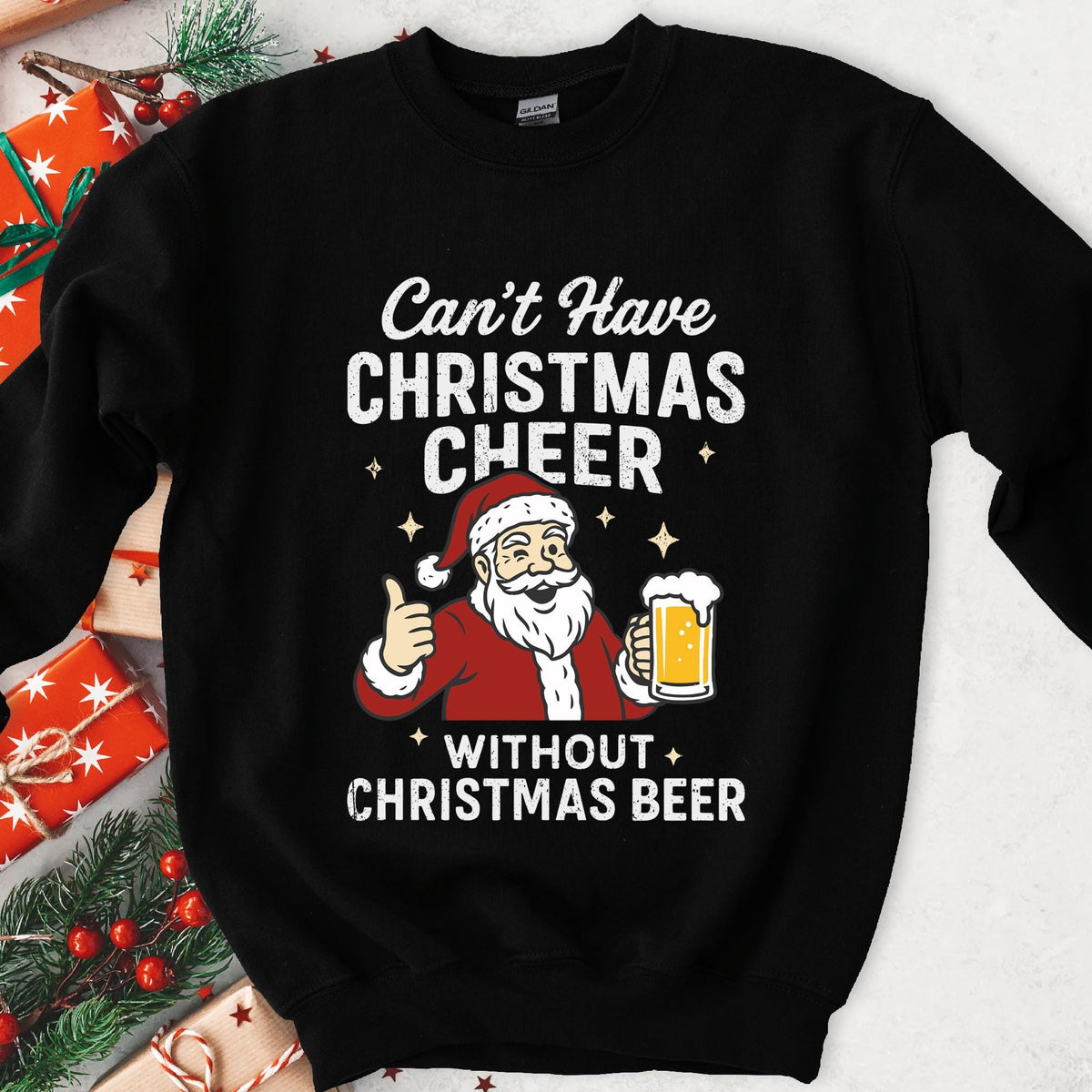 Dark sweatshirt with a winking cartoon Santa holding beer, text Can't Have Christmas Cheer Without Christmas Beer