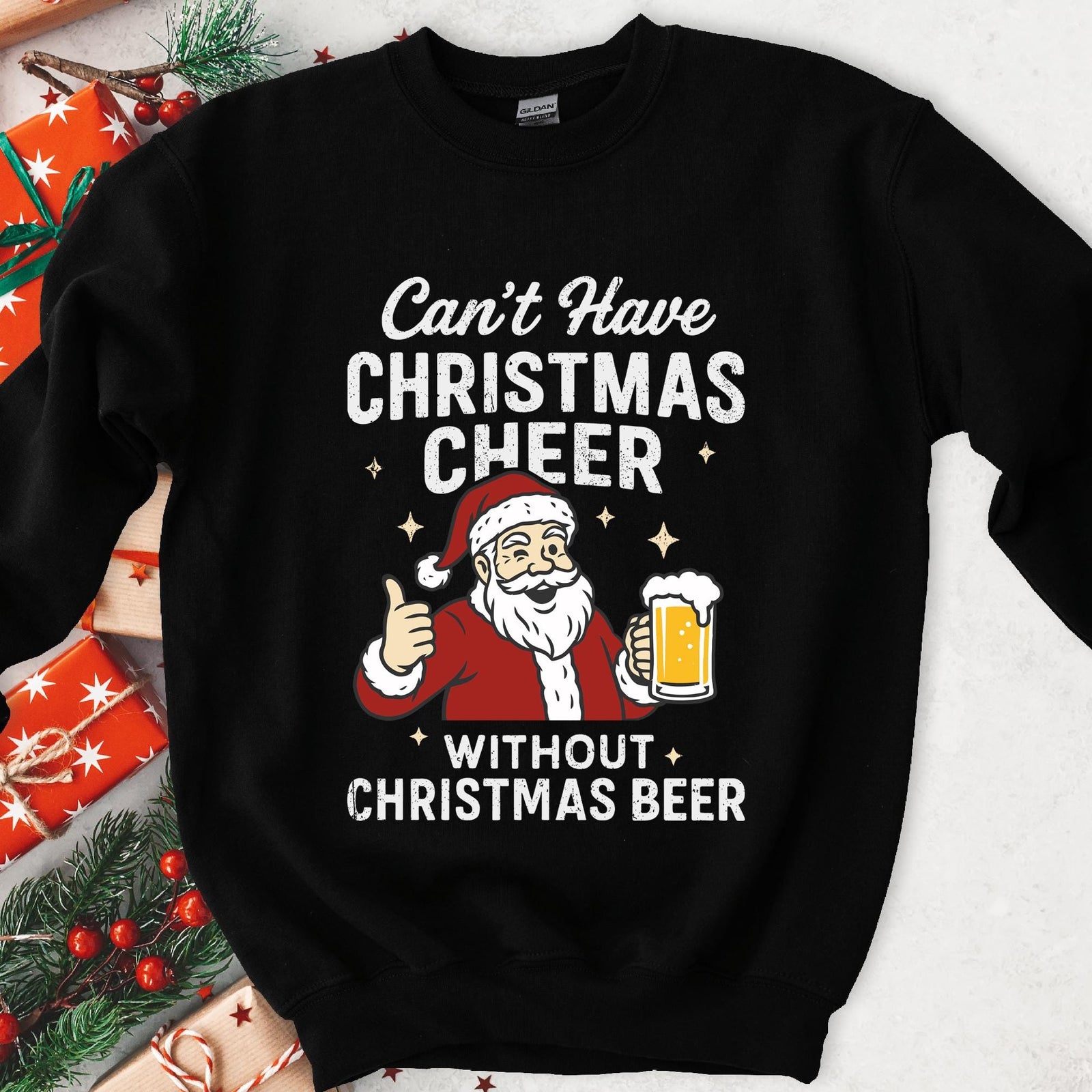 Dark sweatshirt with a winking cartoon Santa holding beer, text Can't Have Christmas Cheer Without Christmas Beer