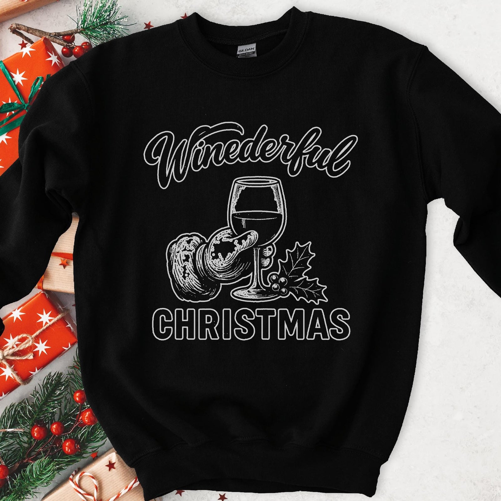 Dark sweatshirt with outlined gray art of Santa's hand holding a wine glass and holly, text Winederful Christmas