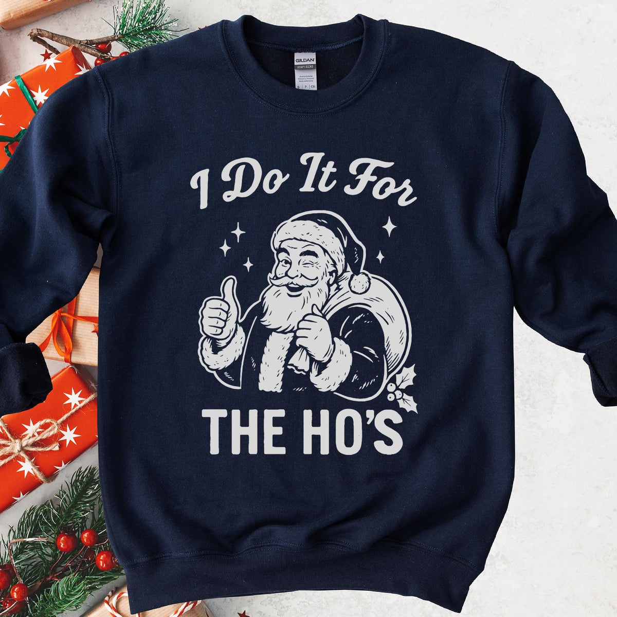 Navy sweatshirt with an I Do It for the Ho's print: a grinning Santa with his gift sack giving a thumbs up