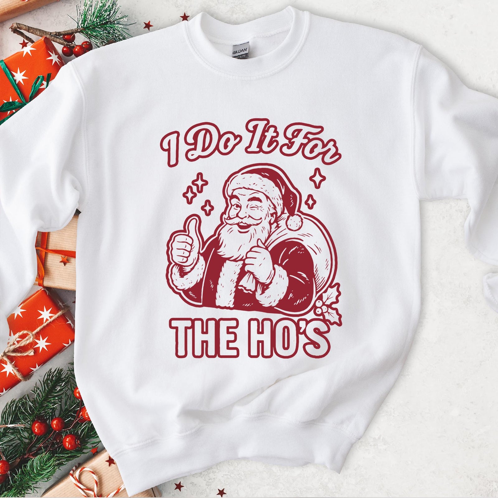 White sweatshirt with an I Do It for the Ho's print: a grinning Santa with his gift sack giving a thumbs up