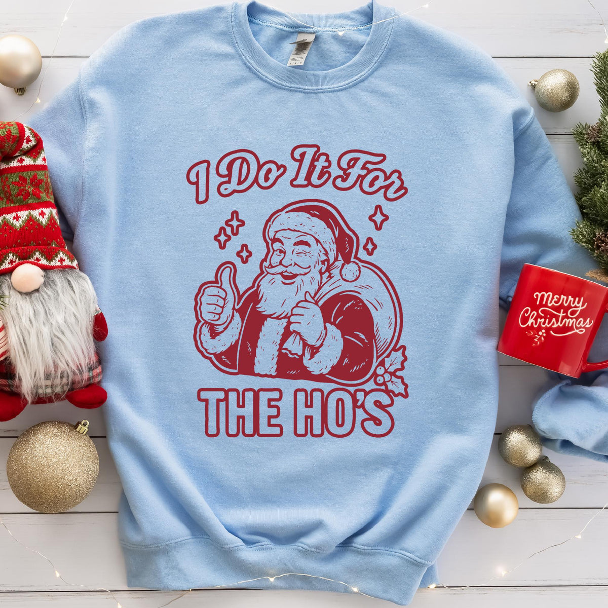 Light Blue sweatshirt with an I Do It for the Ho's print: a grinning Santa with his gift sack giving a thumbs up