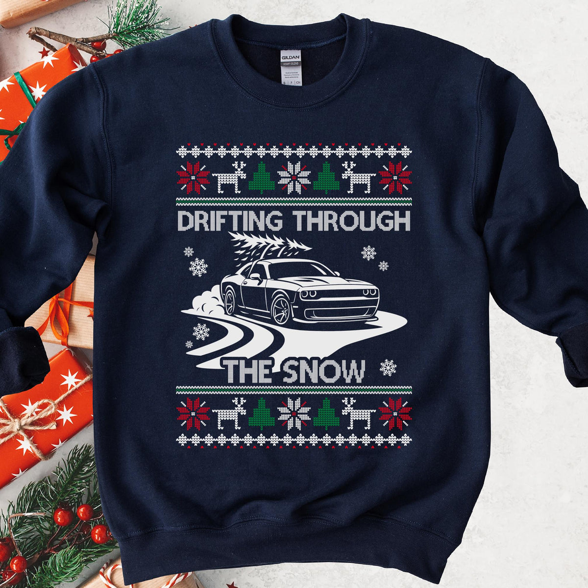 Navy sweatshirt with a Drifting Through the Snow ugly Christmas print: a widebody muscle coupe with a tree on the roof drifting through the snow