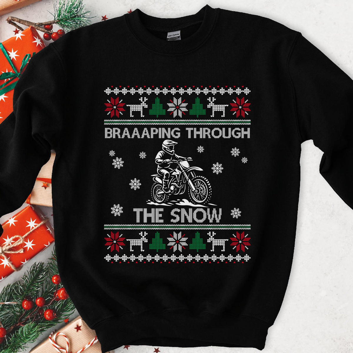 Dark Christmas sweatshirt with a dirt bike rider in snow, BRAAAPING THROUGH THE SNOW and knit sweater borders