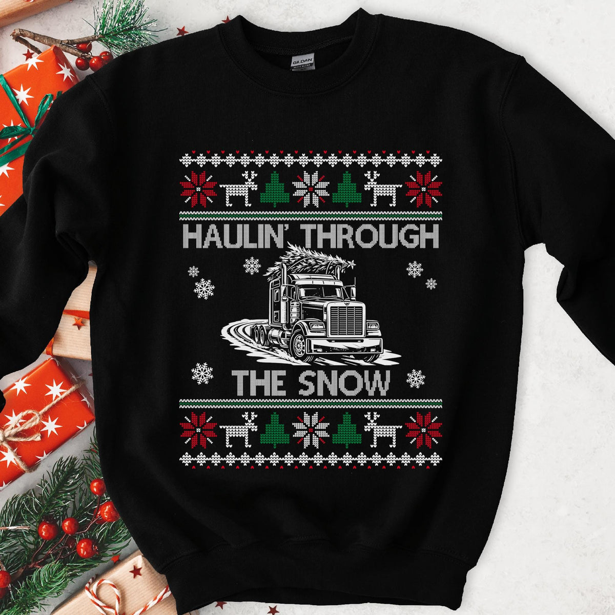 Dark Christmas sweatshirt with a semi truck hauling a tree through snow, HAULIN' THROUGH THE SNOW, knit borders