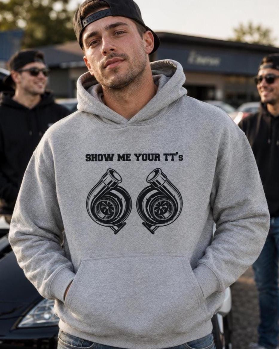 Black hoodie with SHOW ME YOUR TT'S above two white turbocharger illustrations side by side