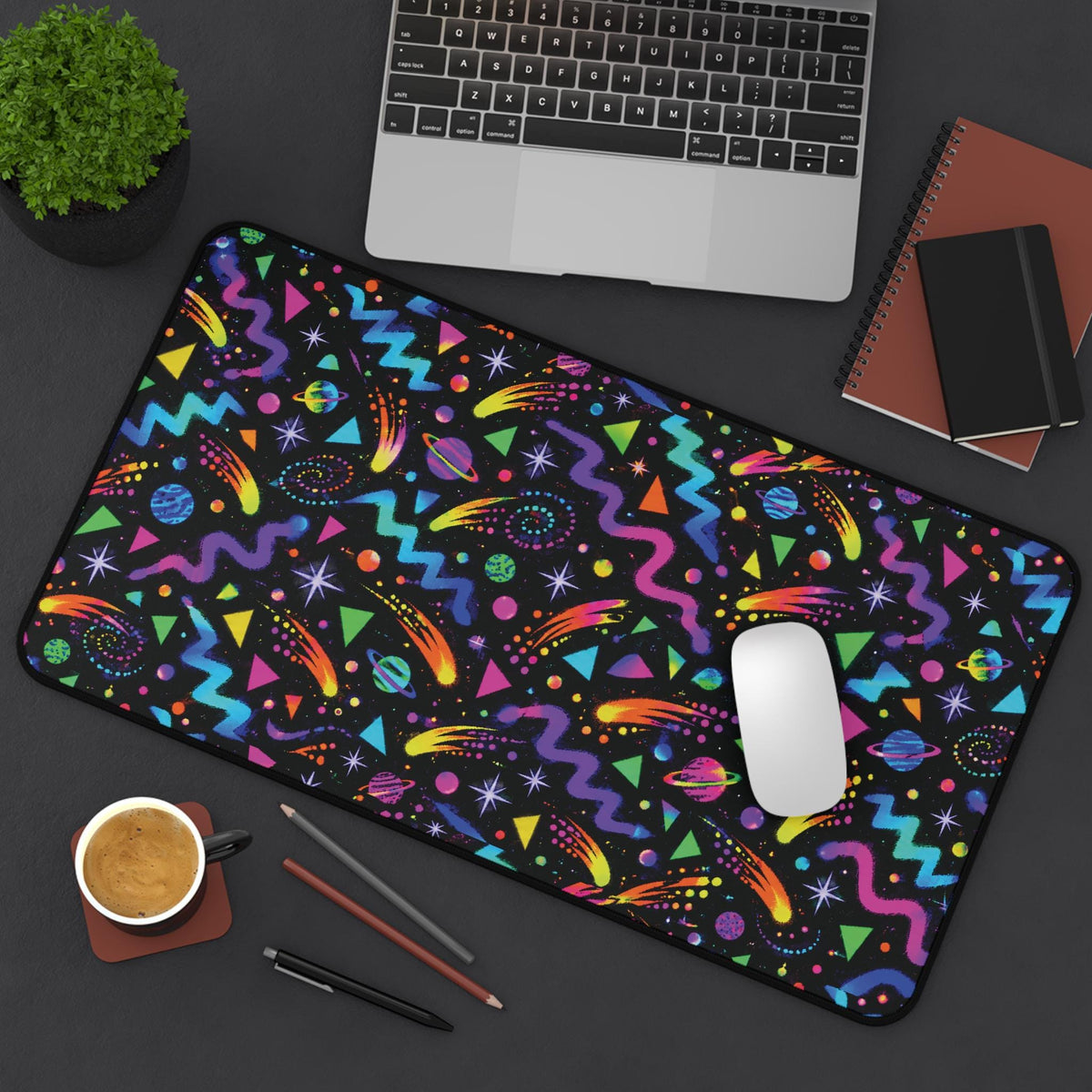 Arcade carpet desk mat on a dark desk with mouse and coffee, top view