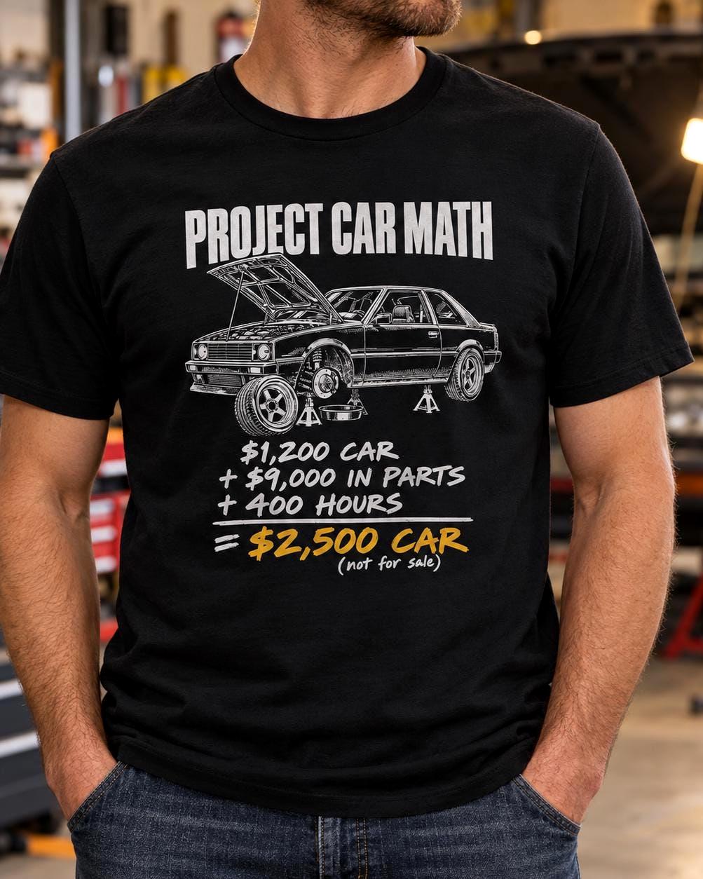Man wearing the black Project Car Math t-shirt in a garage