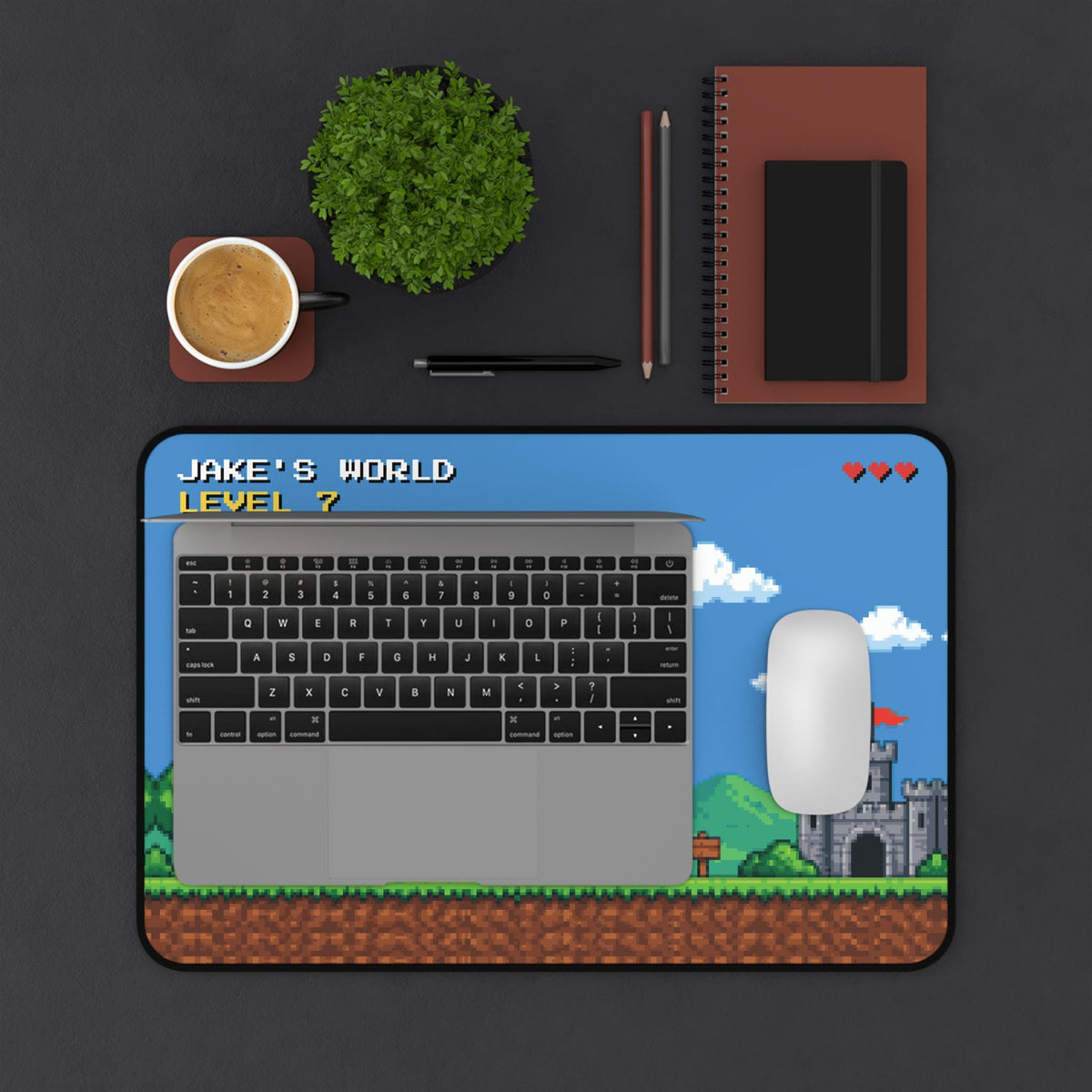 Personalized pixel art desk mat as a laptop and mouse pad, top view