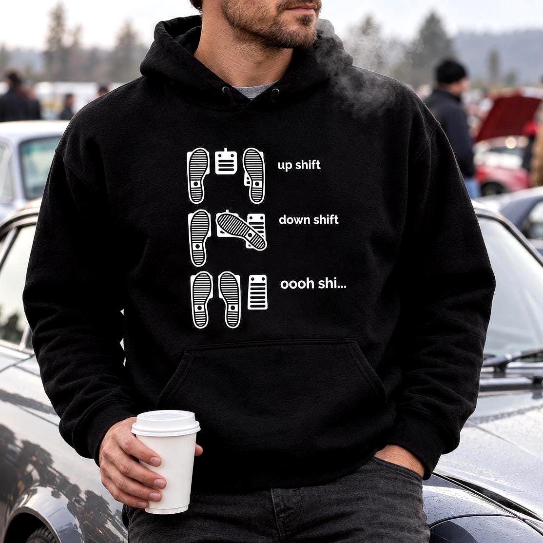 Black hoodie with shoe prints on three pedals labeled up shift, down shift and oooh shi...