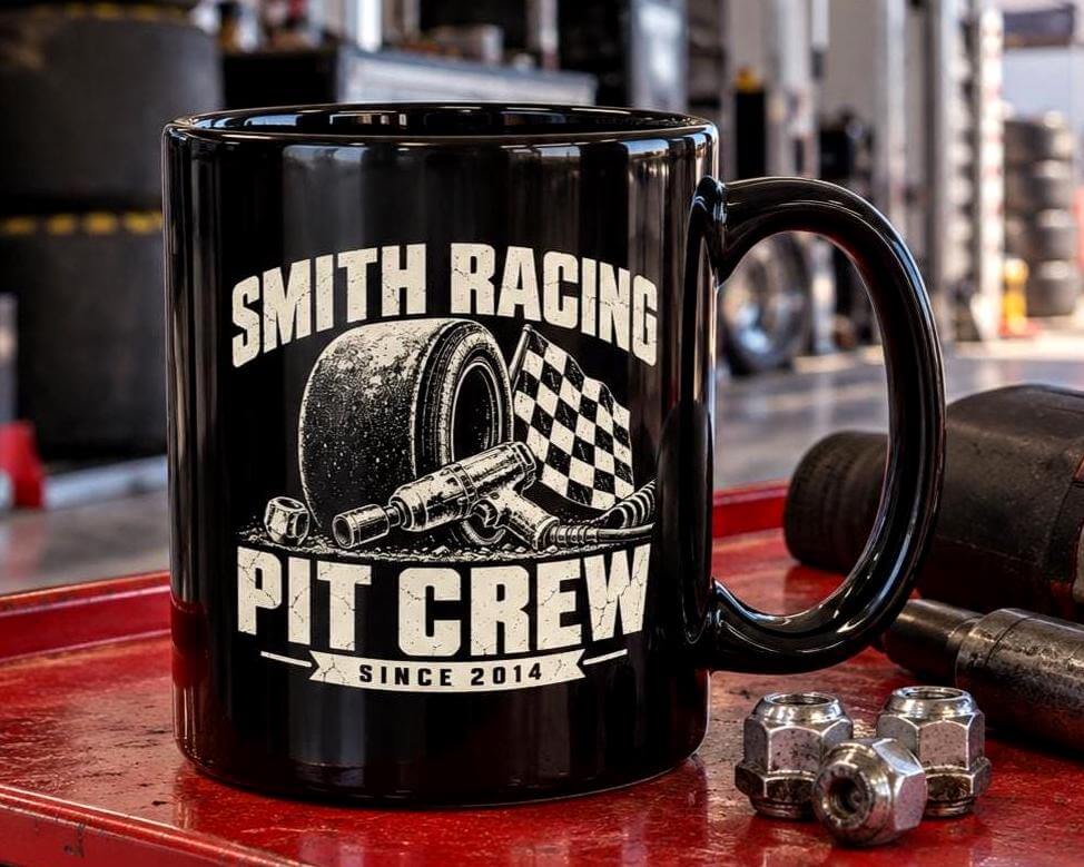 11oz black personalized Pit Crew racing mug on a tool cart next to an impact wrench and lug nuts inside a race trailer