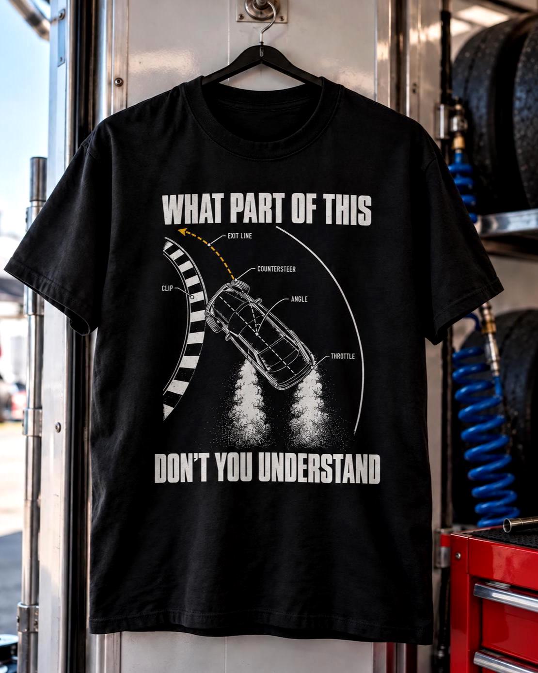 Black What Part Of This Don't You Understand drifting t-shirt hanging inside a race trailer