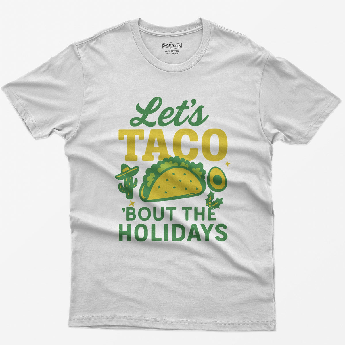 White t-shirt with Let's Taco Bout The Holidays in green and yellow, with a taco, a cactus in a sombrero, avocado and holly