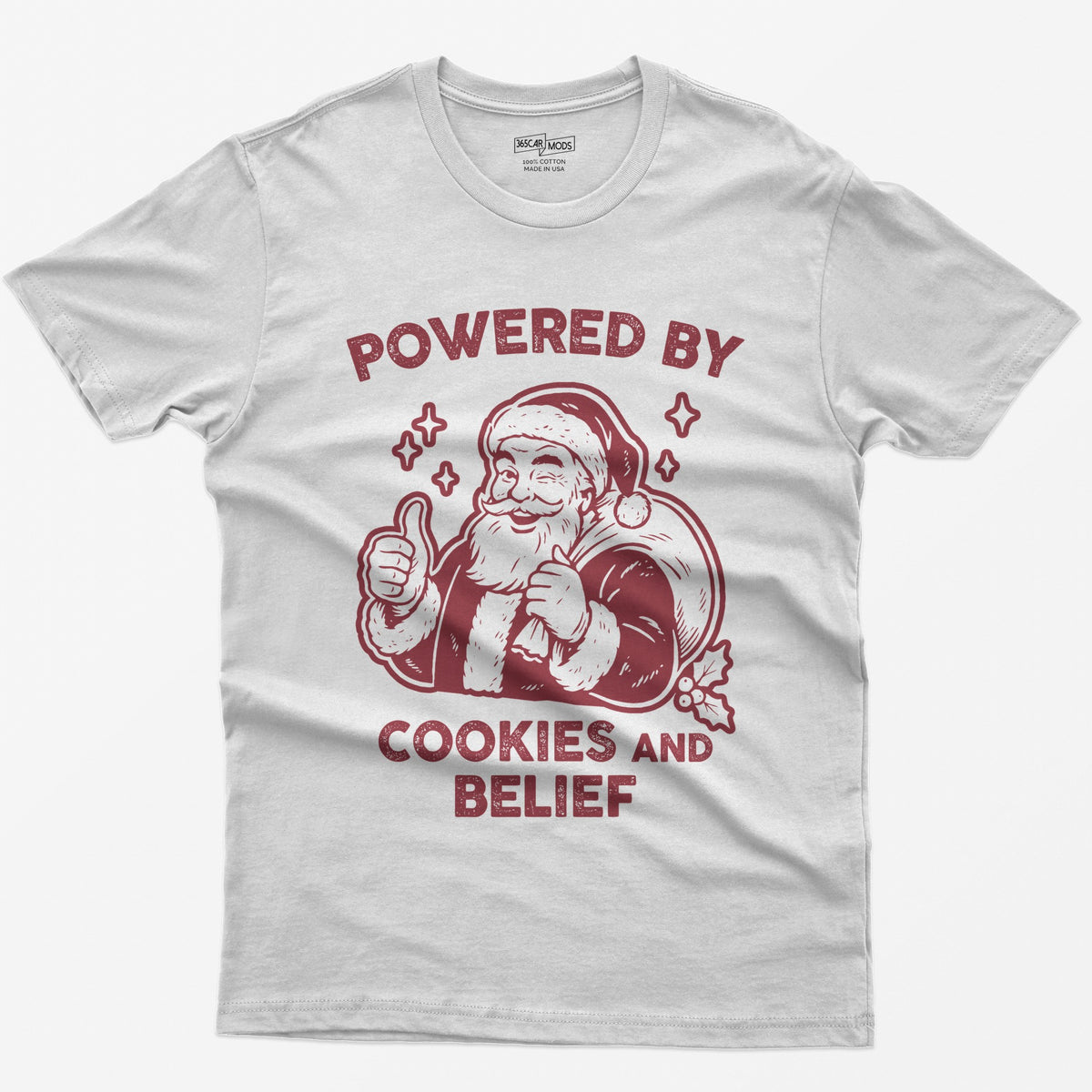 White t-shirt with vintage white print of a winking Santa giving a thumbs up and the words Powered by Cookies and Belief