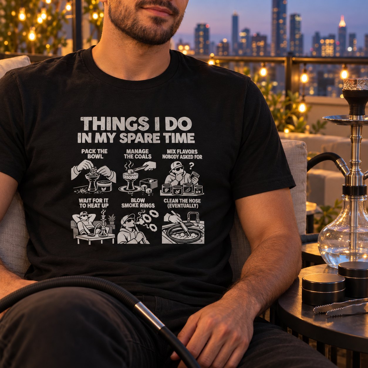 Man in the black hookah spare time t-shirt on a rooftop lounge at night