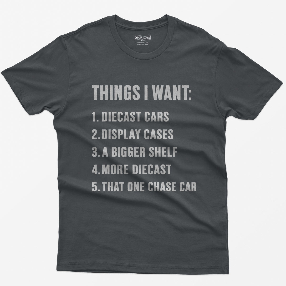 Charcoal t-shirt with white block text Things I Want list: diecast cars, display cases, a bigger shelf, that one chase car