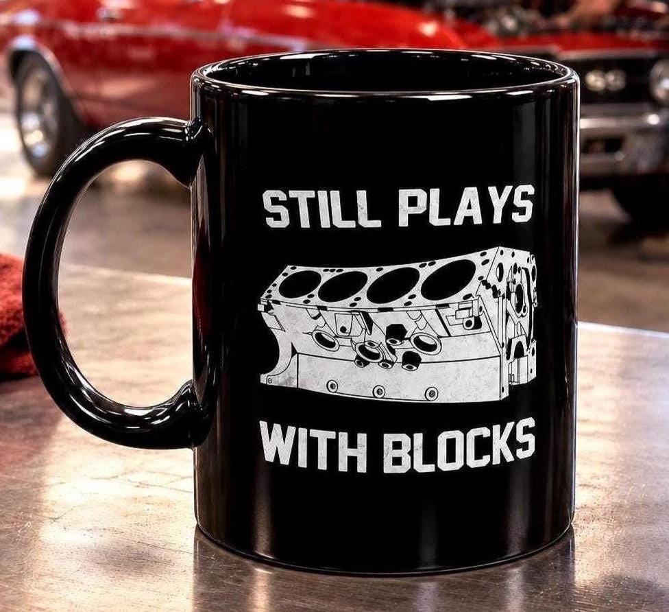 Still Plays With Blocks Coffee Mug - 15oz black coffee mug, angled view