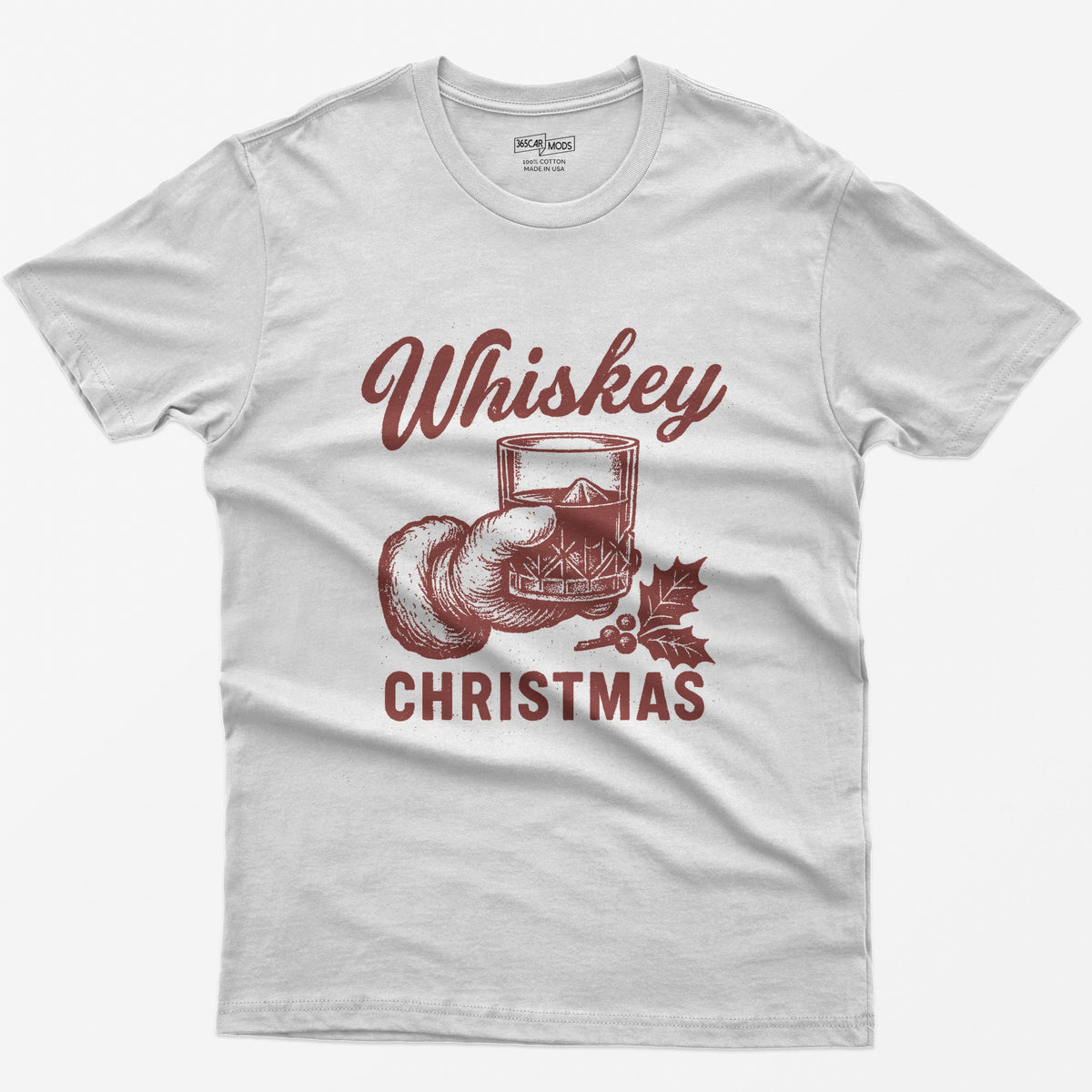 White t-shirt with red vintage-style print of a Santa hand holding a whiskey rocks glass with holly, text Whiskey Christmas
