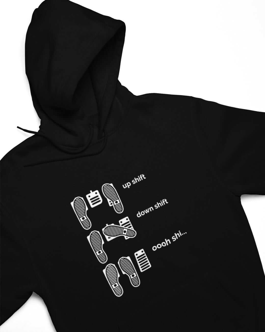 Up Shift Down Shift Oooh Shi hoodie in black — flat lay | funny car enthusiast hoodie